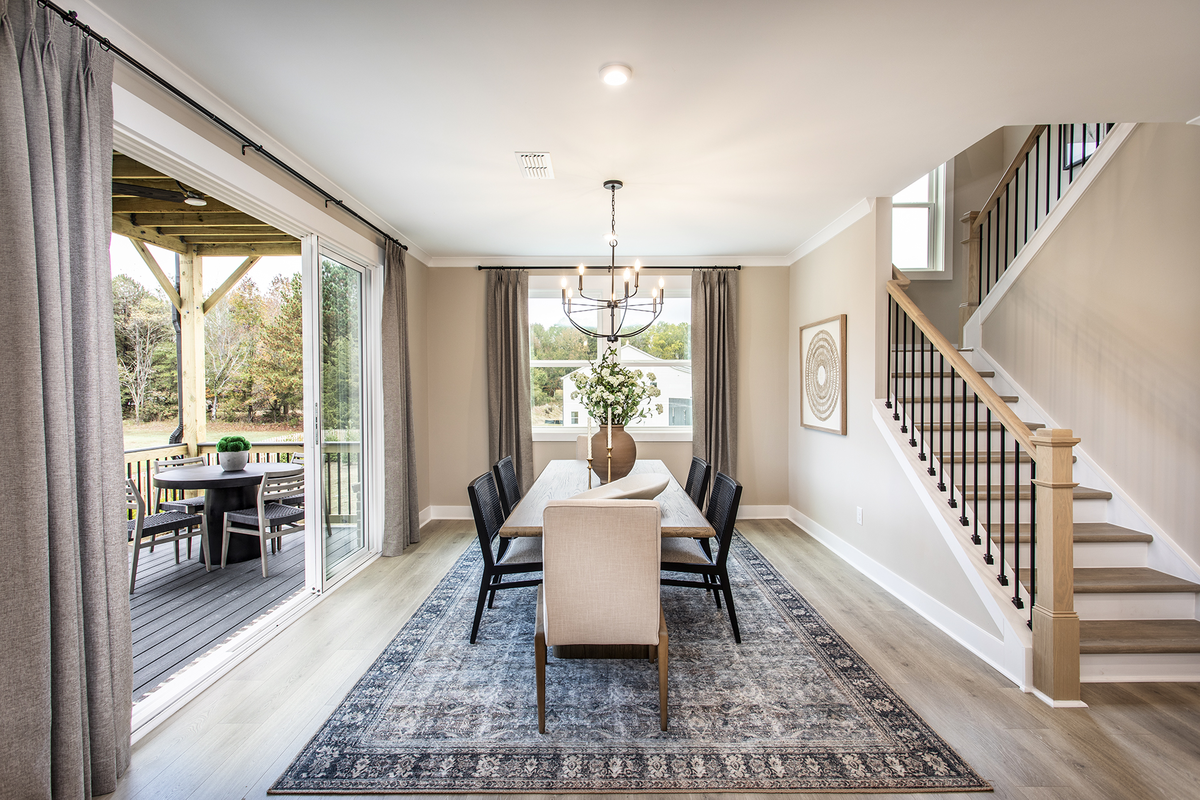 dining room open to kitchen with large table