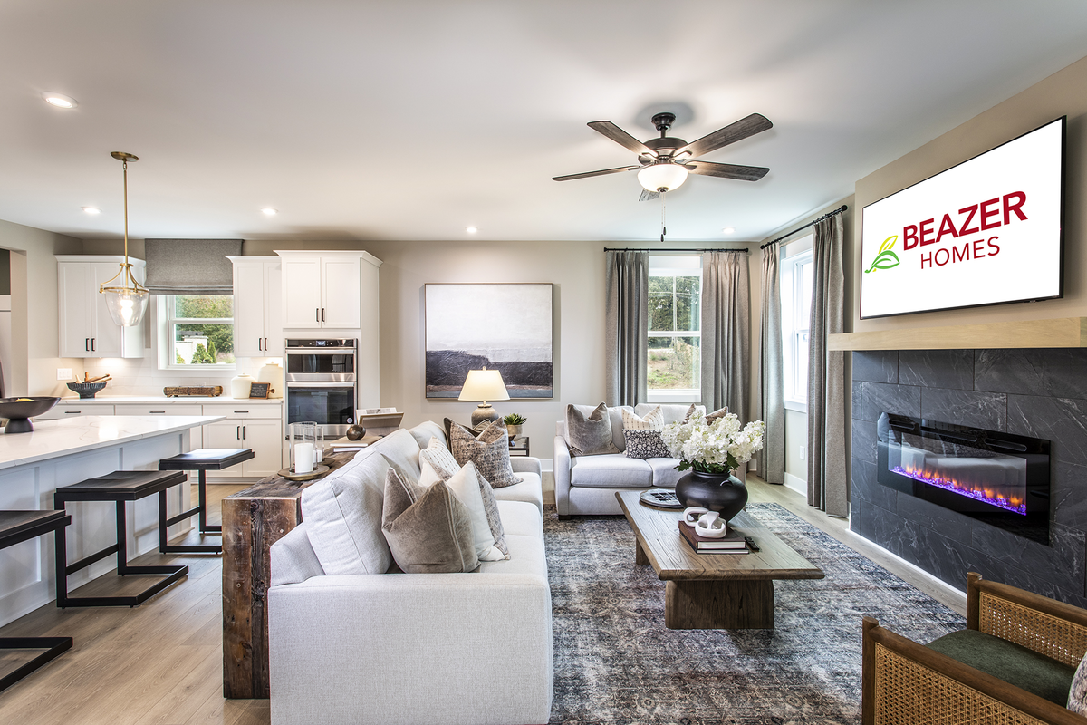 great room with fireplace and light plank flooring