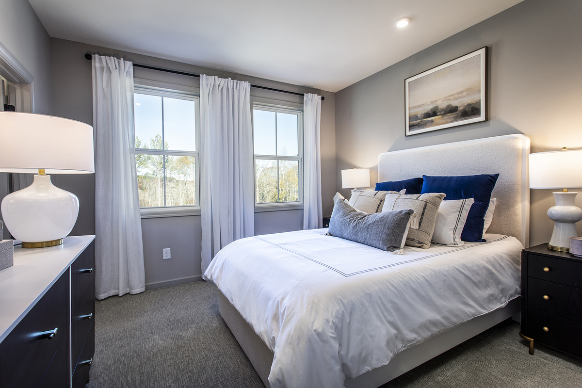 bedroom with carpet and windows