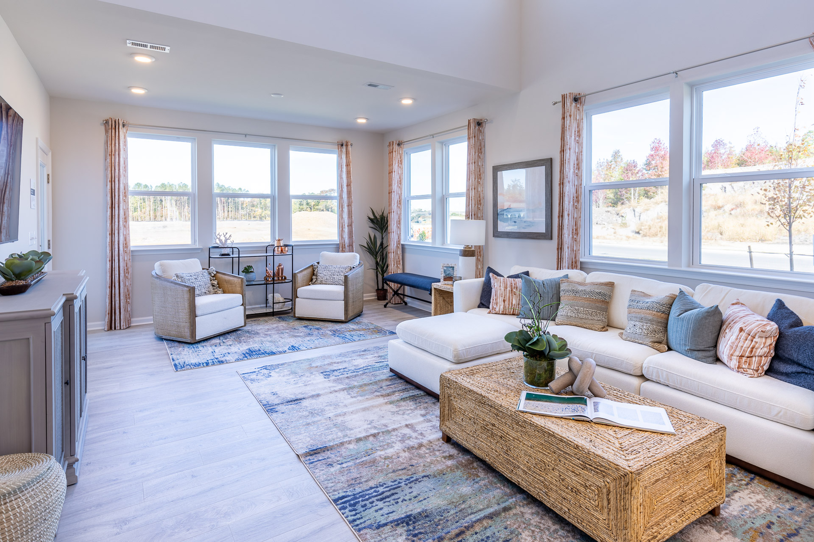 great room with a white couch & designer floors