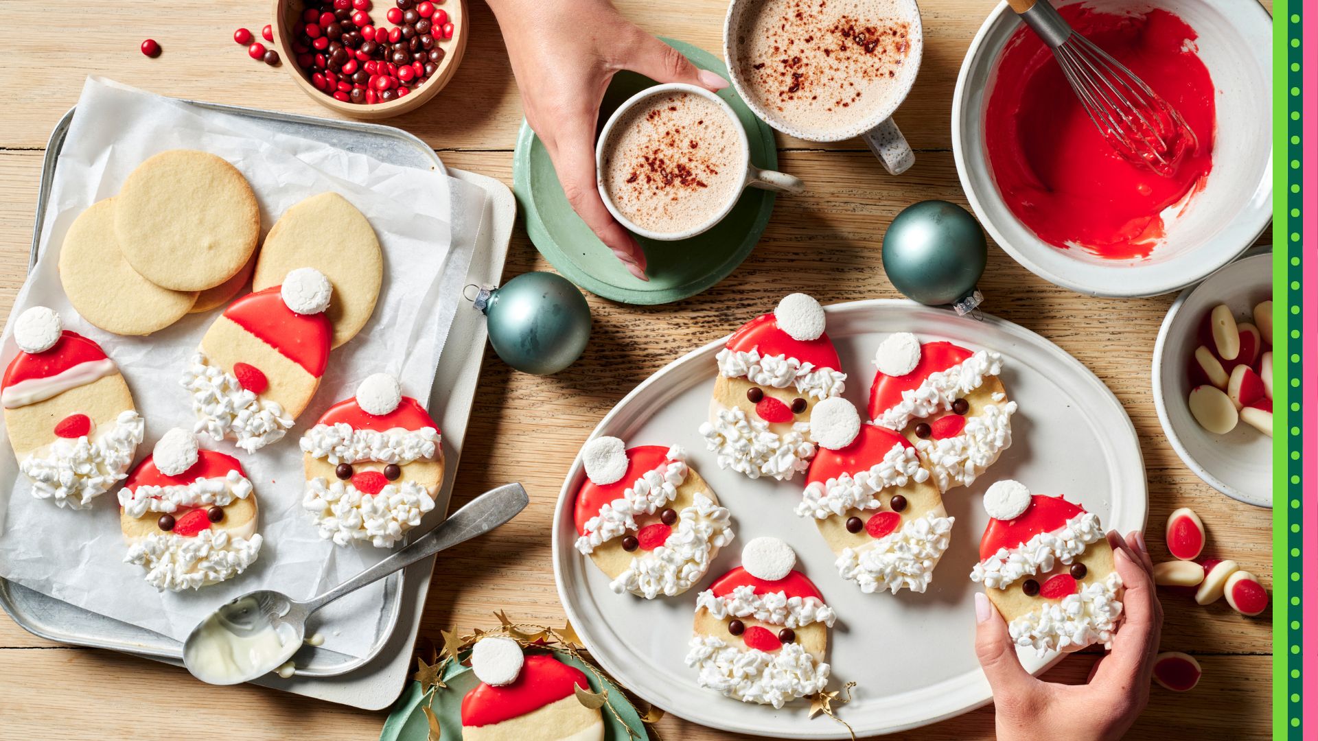 A plate of festive sugar cookies decorated to look like Santa Claus, complete with red and white icing, a fluffy white beard, rosy cheeks, and a signature red hat with a white pom-pom.