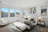 spacious bedroom with a large white bed, a white bed bench, and wooden nightstands