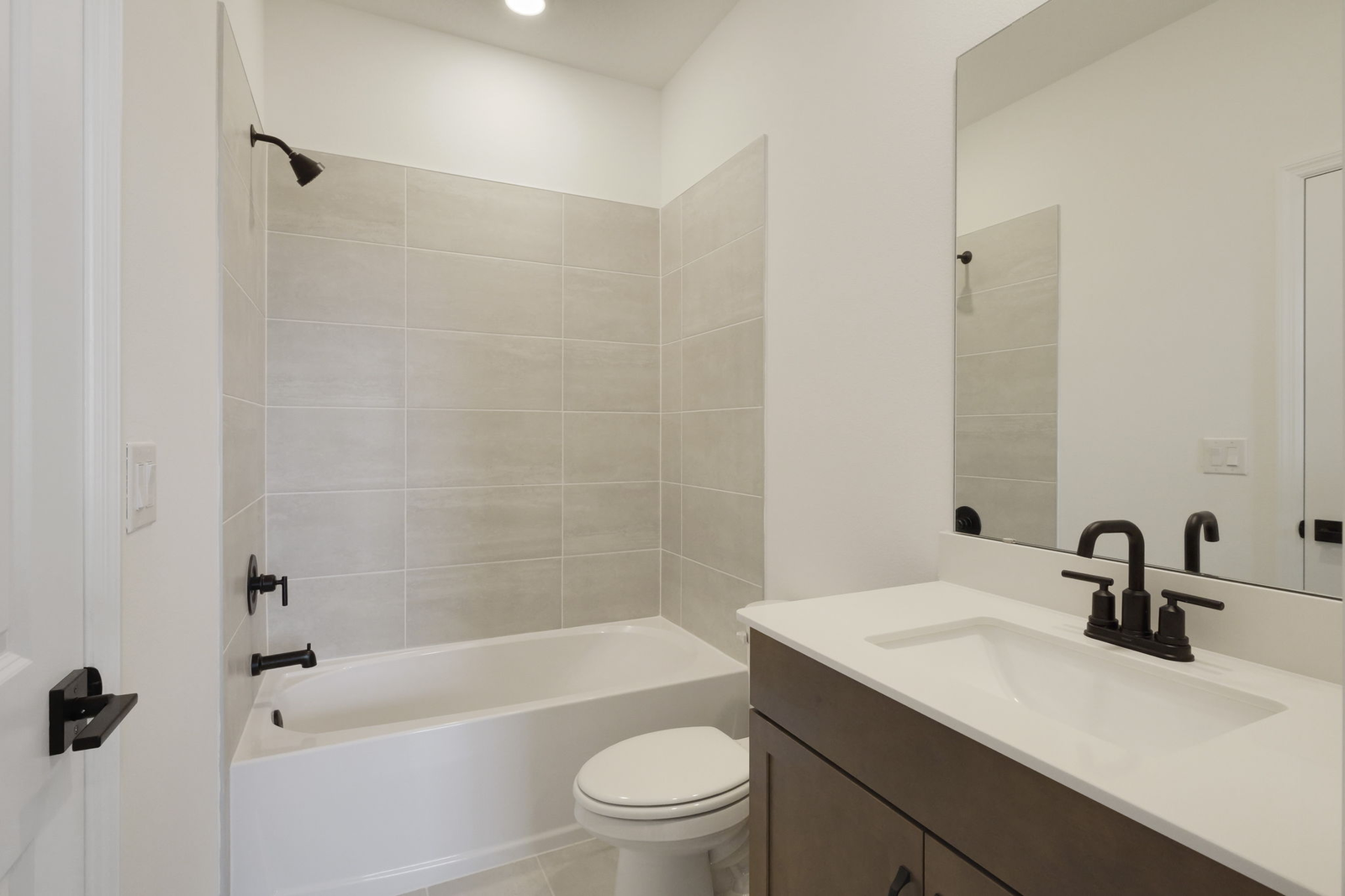single sink vanity with water closet and shower