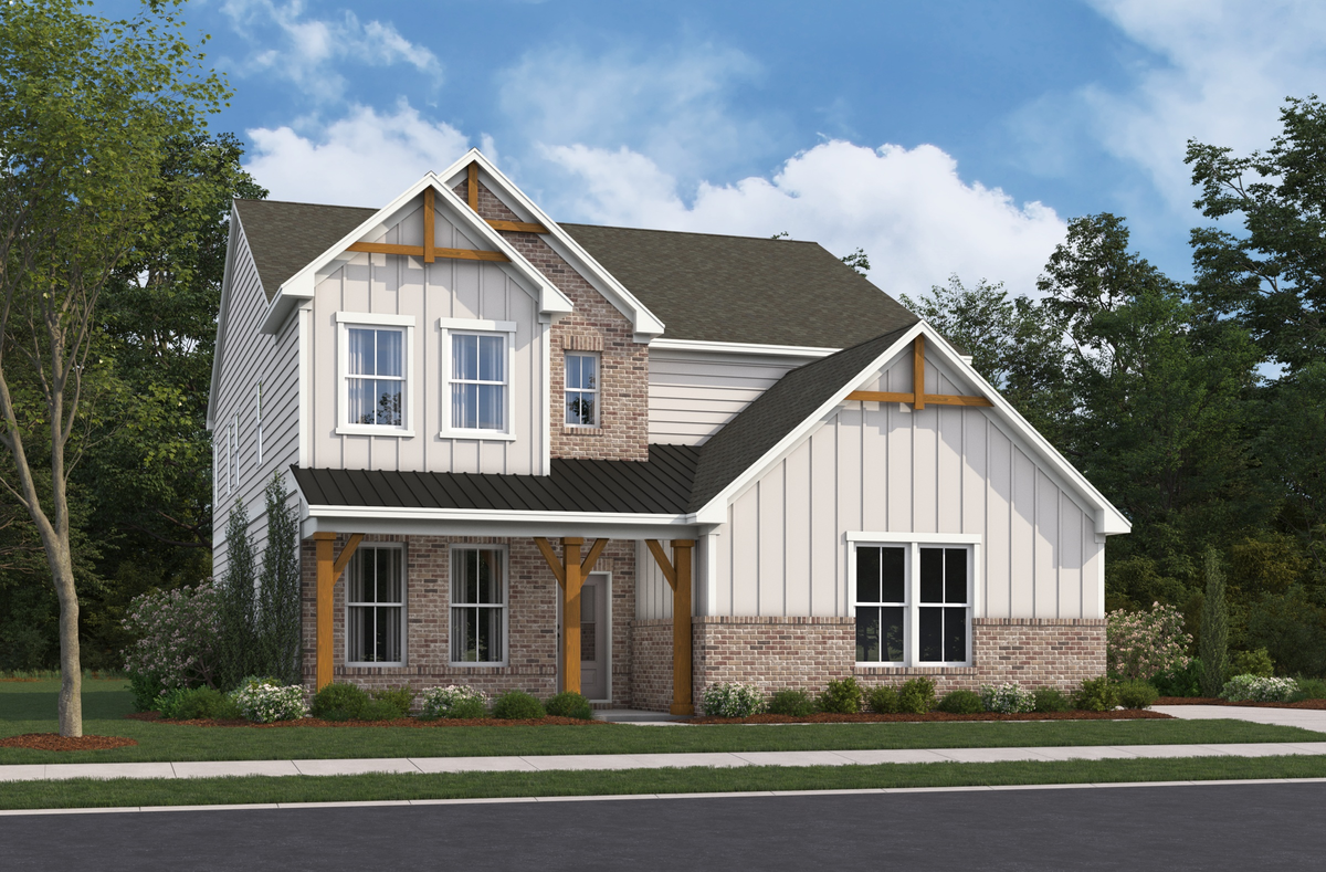 front of 2-story home with light siding and brick