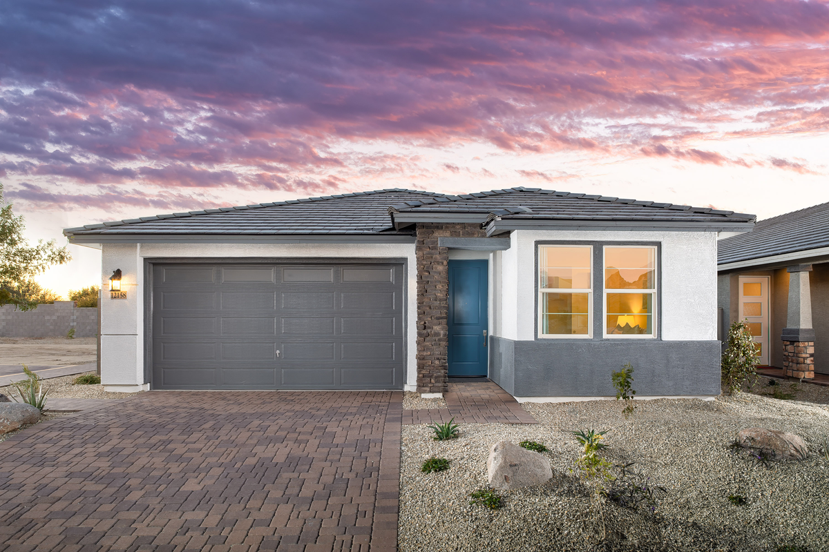 single-story home with paved driveway