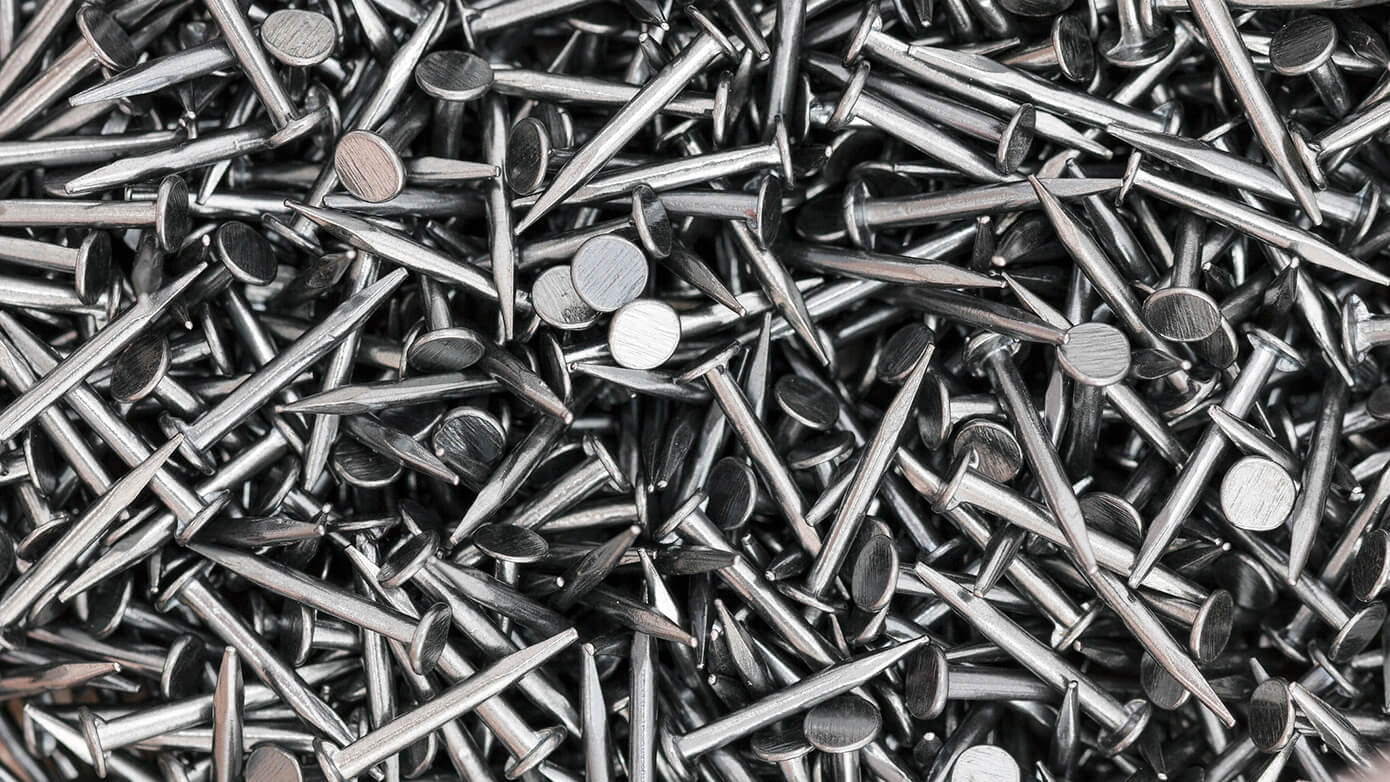 Single-ERP-Environment-Benefits-Card-512229422-1390x782.jpg Image of a pile of nails.