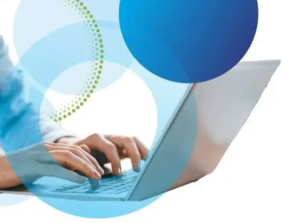 Hands typing on keyboard, decorative circles in blue and green overlaying image