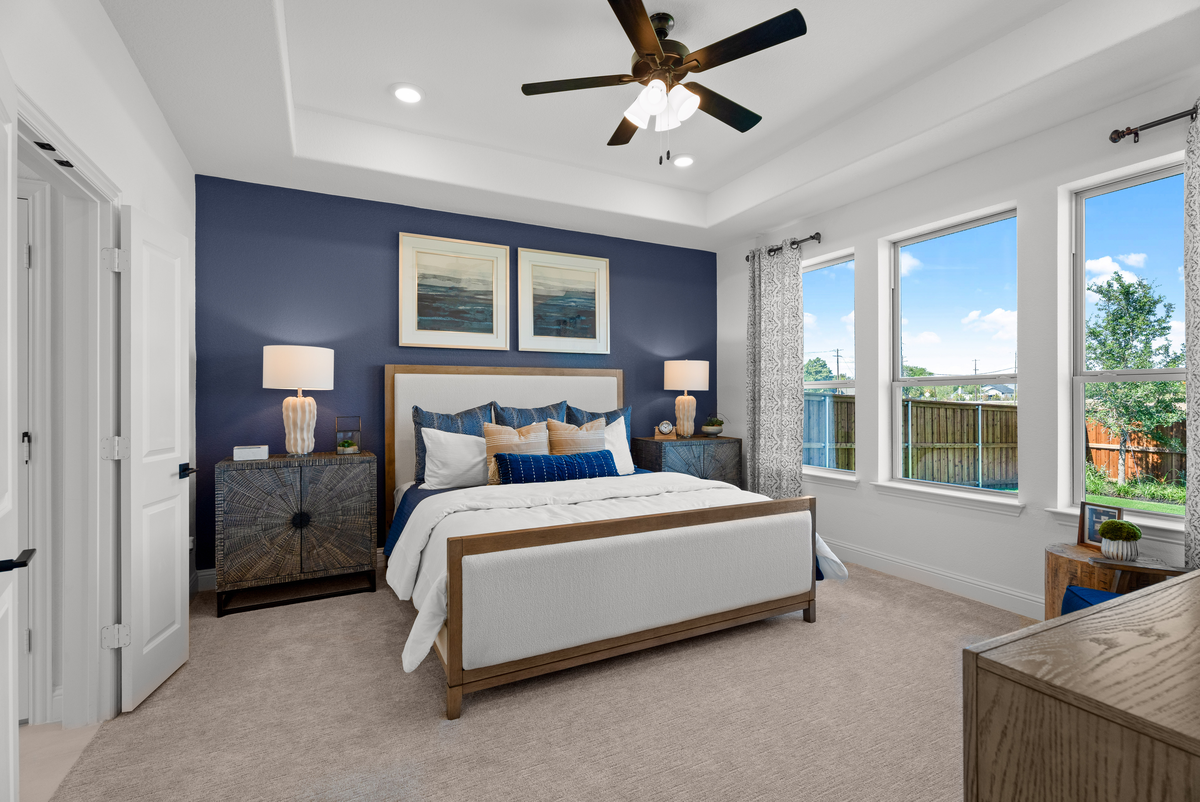 primary bedroom with large windows