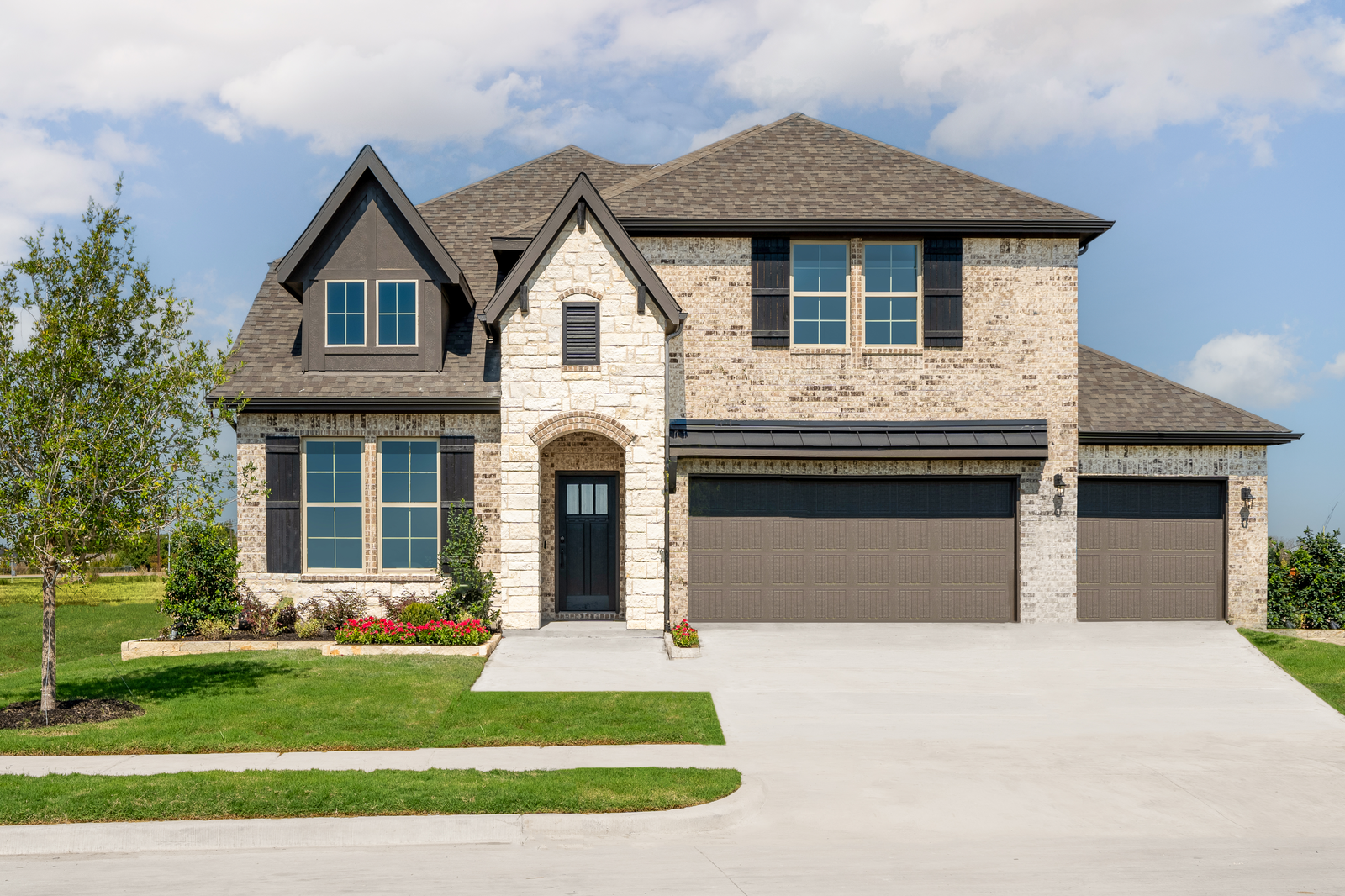 two-story home with brick and stone exterior 