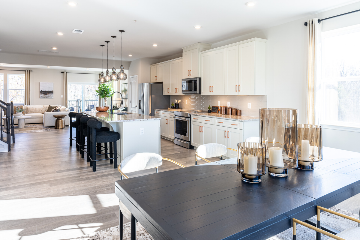 breakfast area with a large table and kitchen