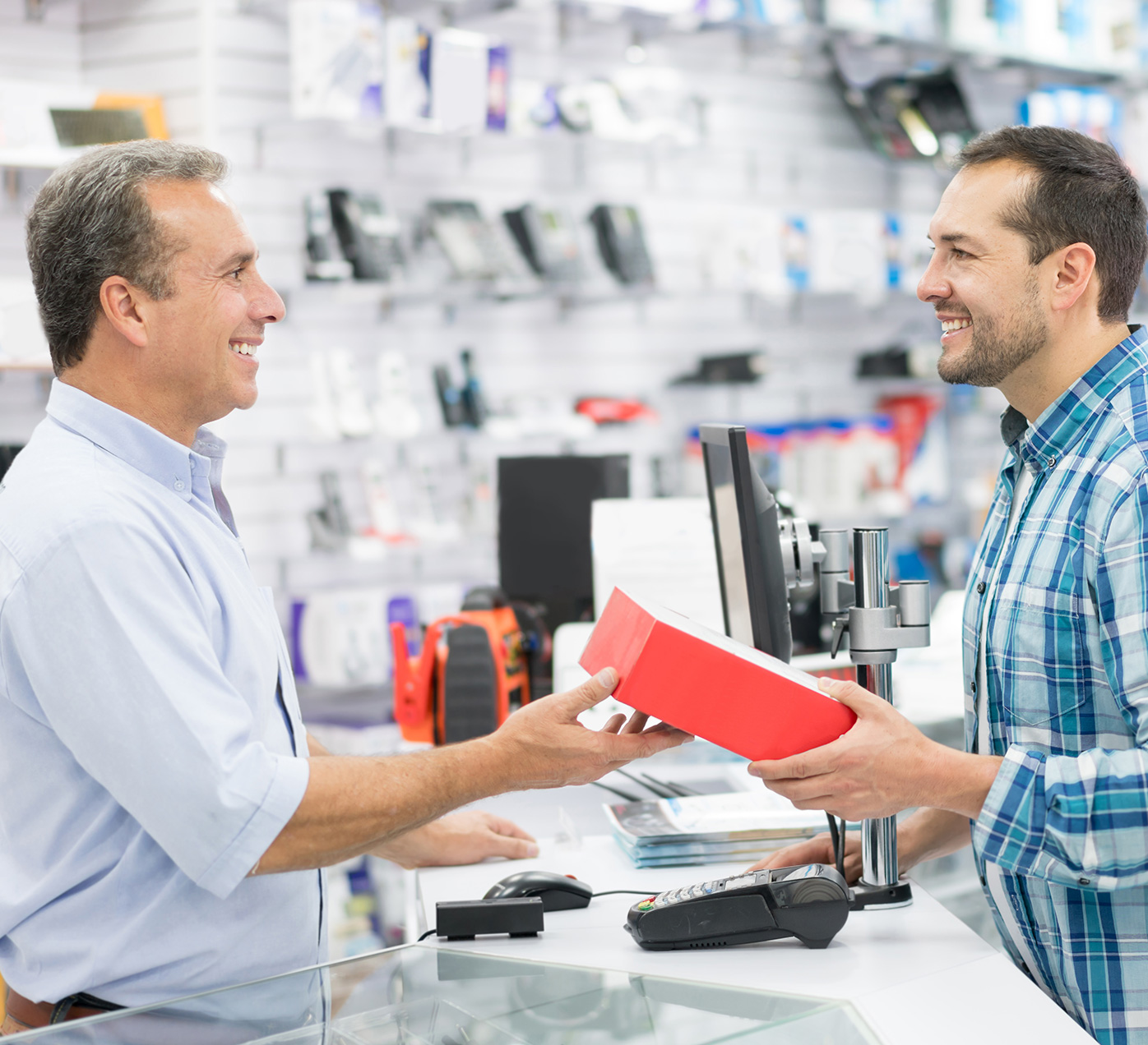 Man and cashier at checkout counter.