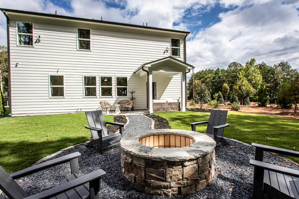 backyard with outdoor firepit & patio furniture