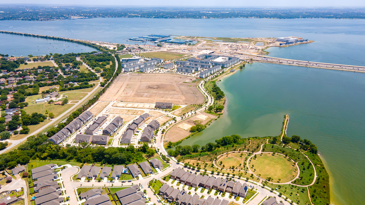 aerial photo of townhomes located near the lake