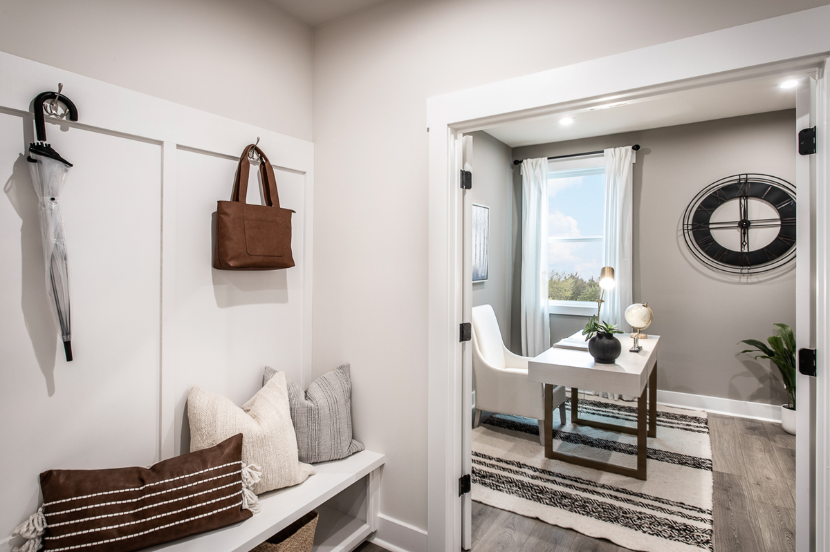 mudroom and study with plank flooring