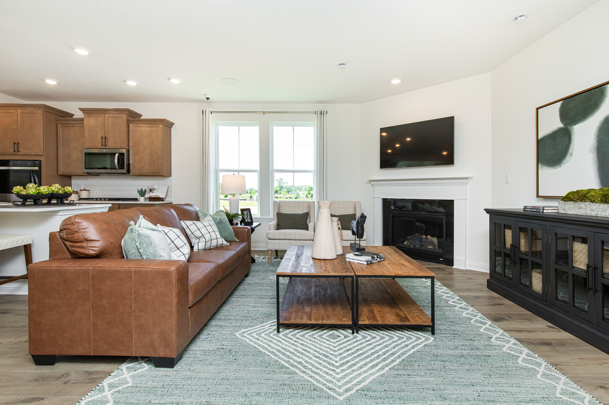 great room with fireplace and hardwood floors 