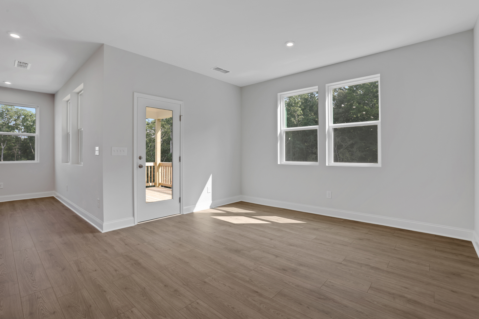 dining room with hard surface flooring and windows