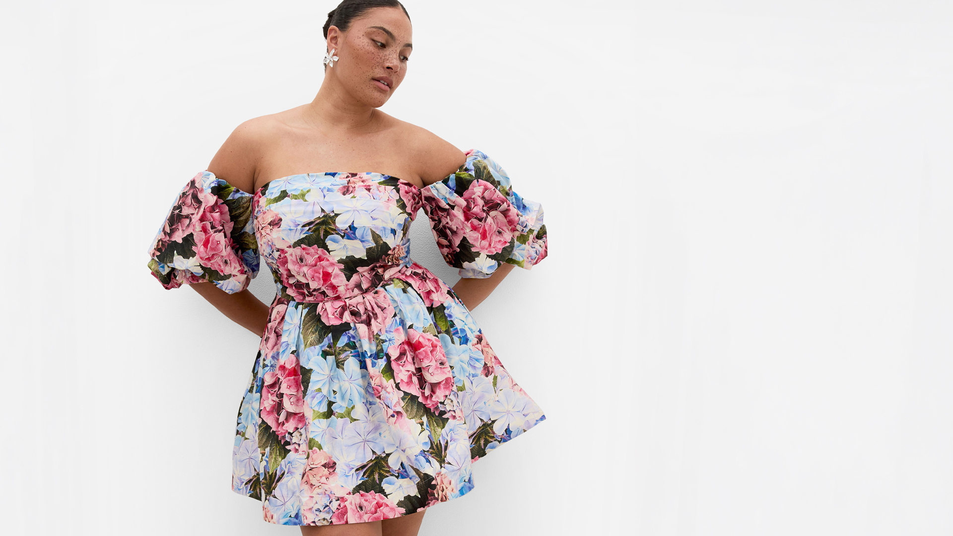 woman in a plus-size floral summer dress