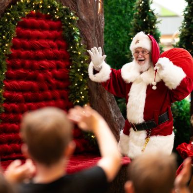 Santa waving to kids