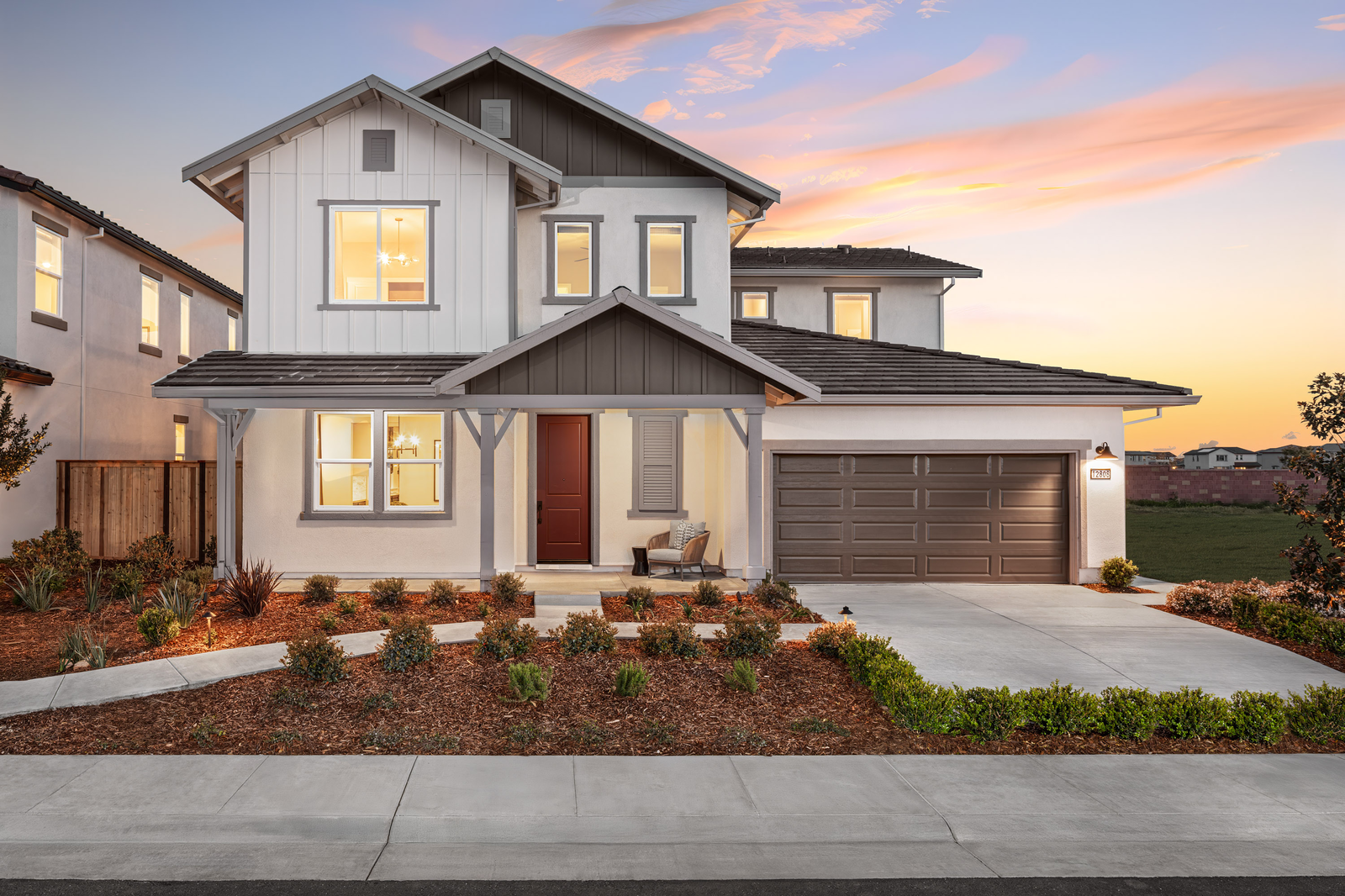 front exterior of two-story white and gray house