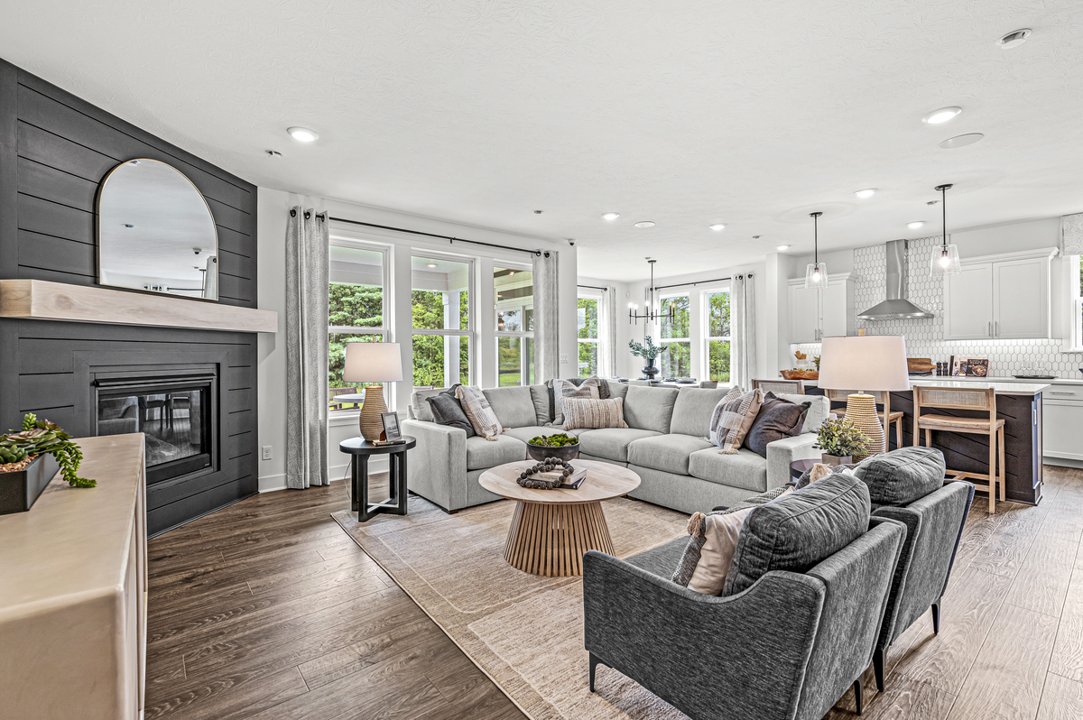 great room with fireplace and hardwood floors 