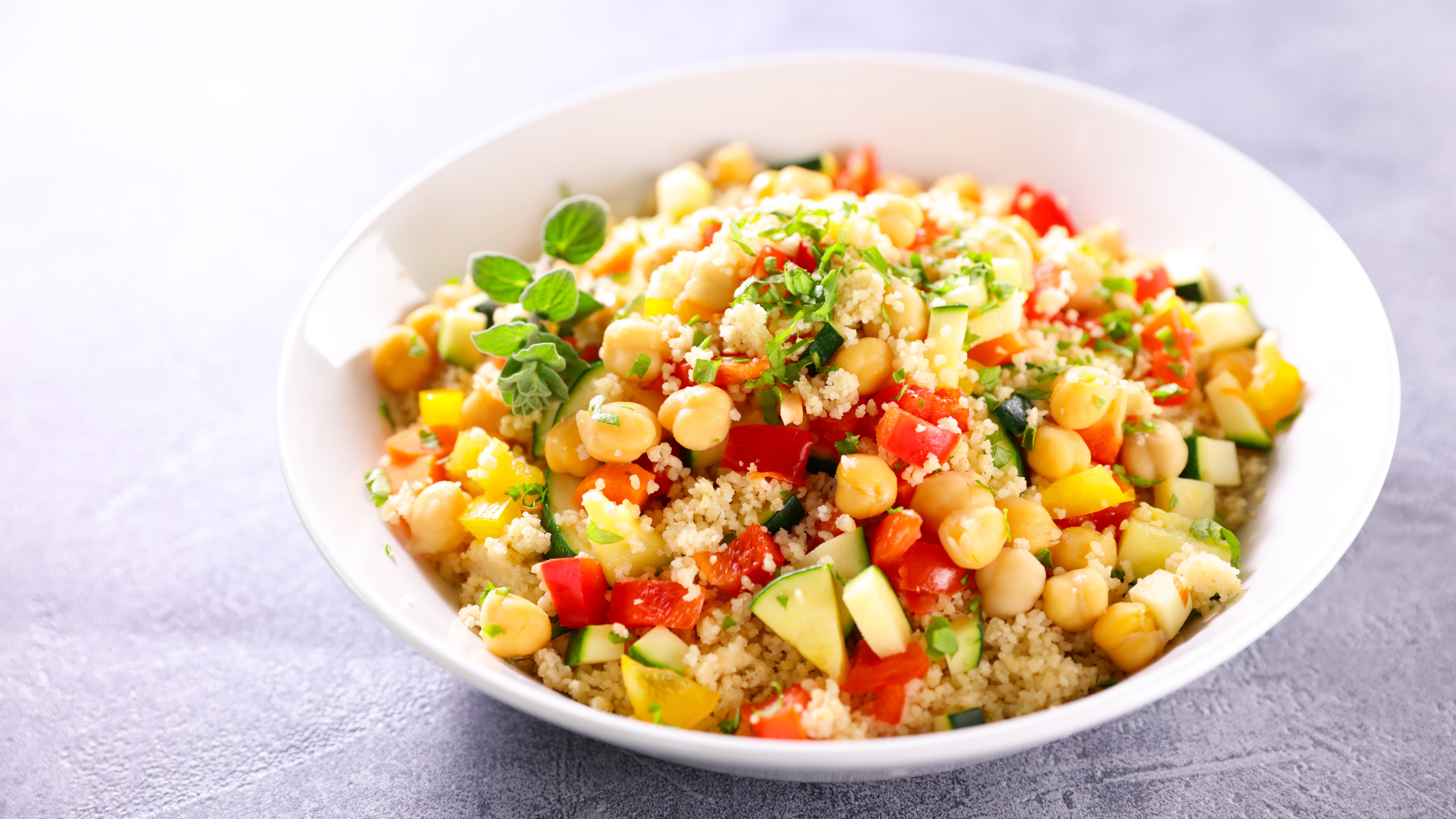 Close up of Nutrition Australia's Chickpea and Couscous Salad served on white plate.