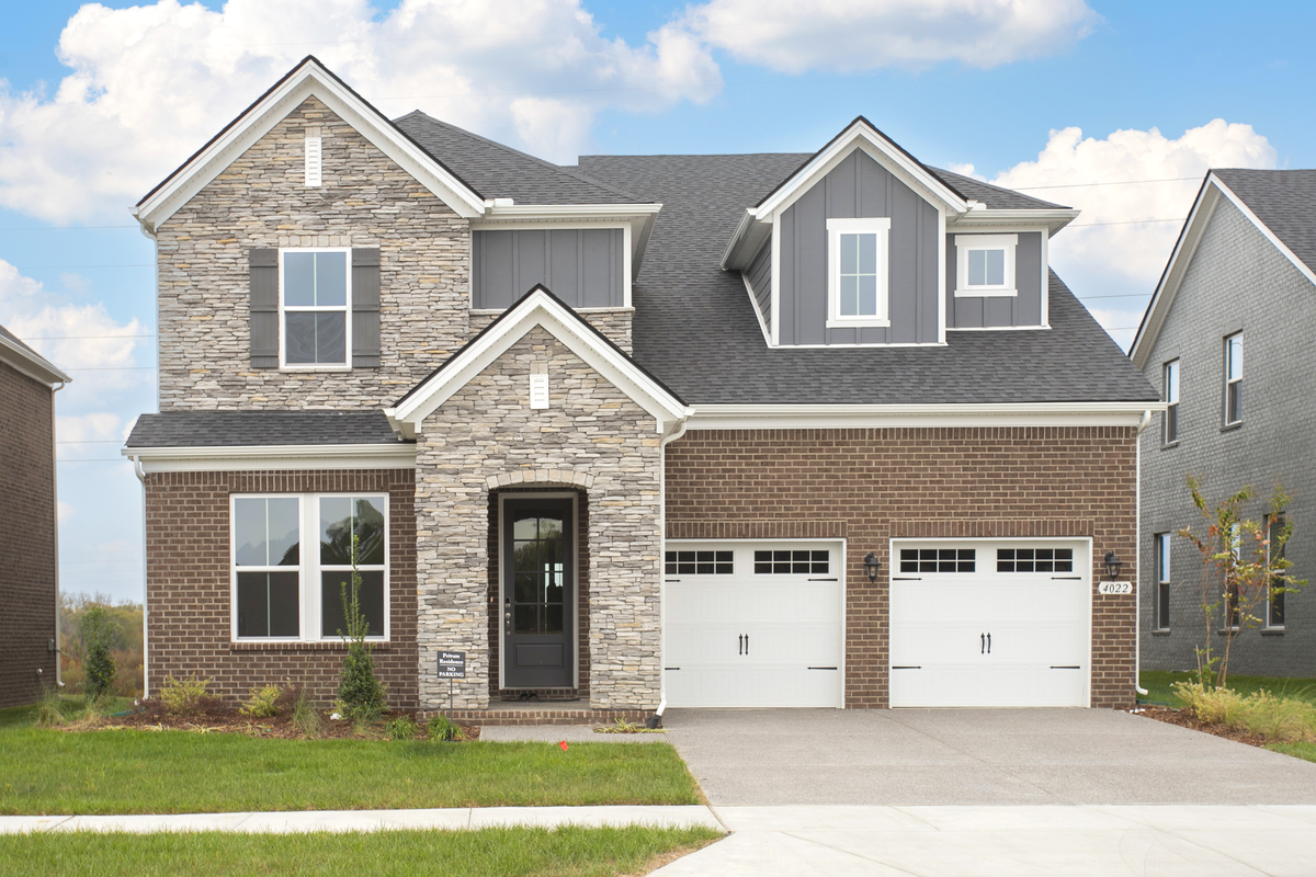 home exterior with stone archway and brick