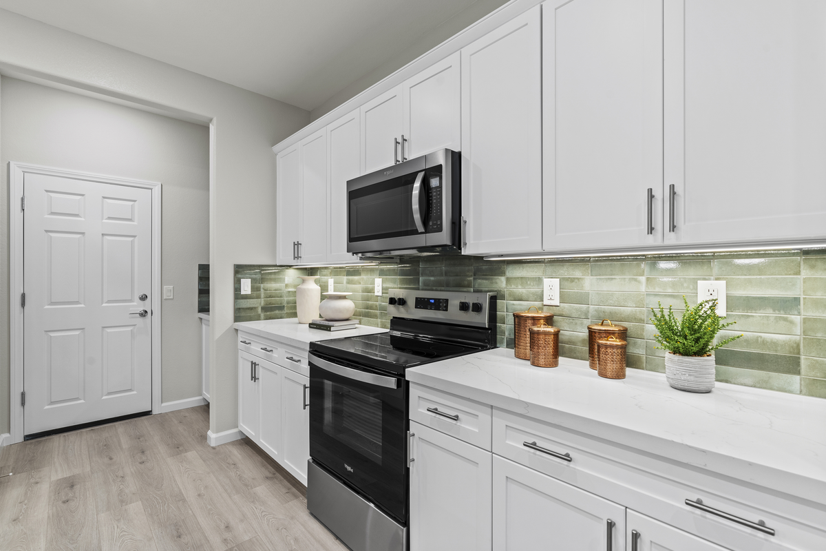 kitchen with white cabinets and white countertops