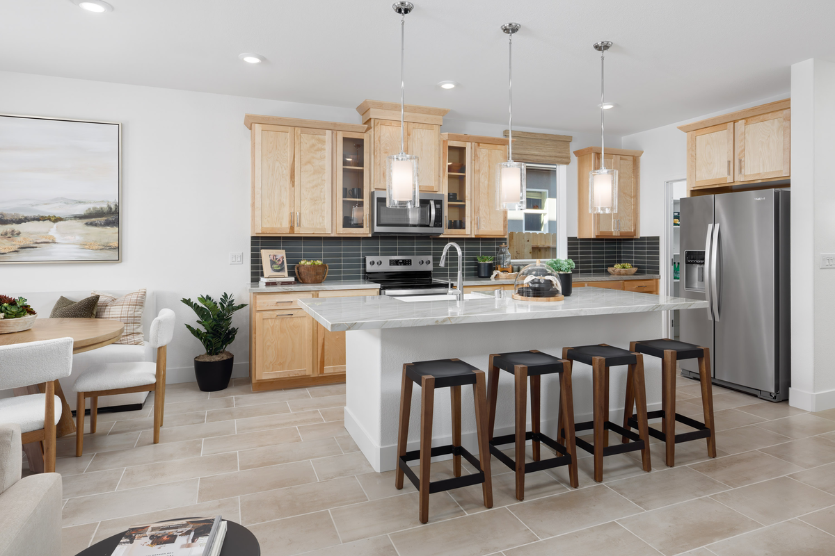 kitchen with light wood cabinets and wood floors