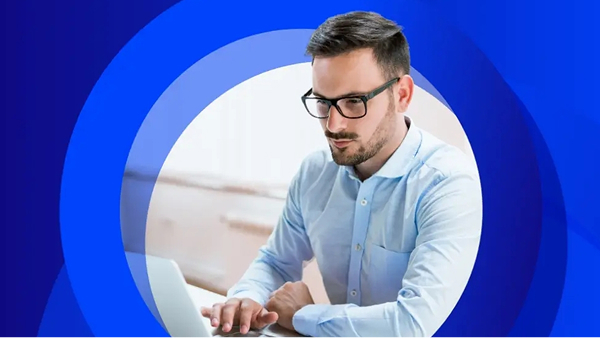 Young professional man working on a laptop, decorative circles in background