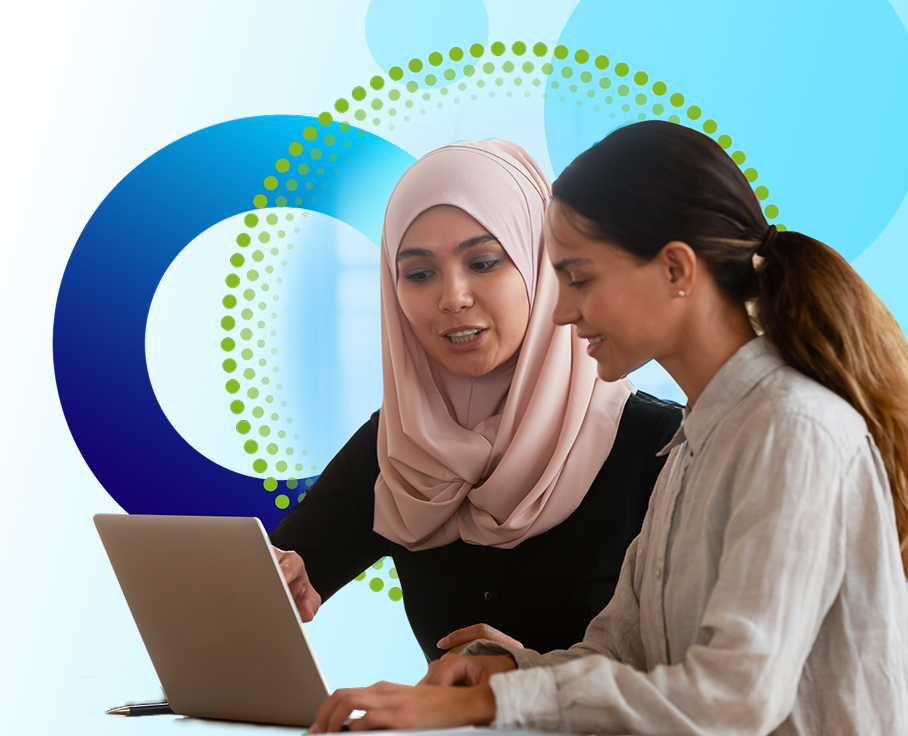 Two smiling young women of different ethnicities looking at a laptop together, with decorative circles in background