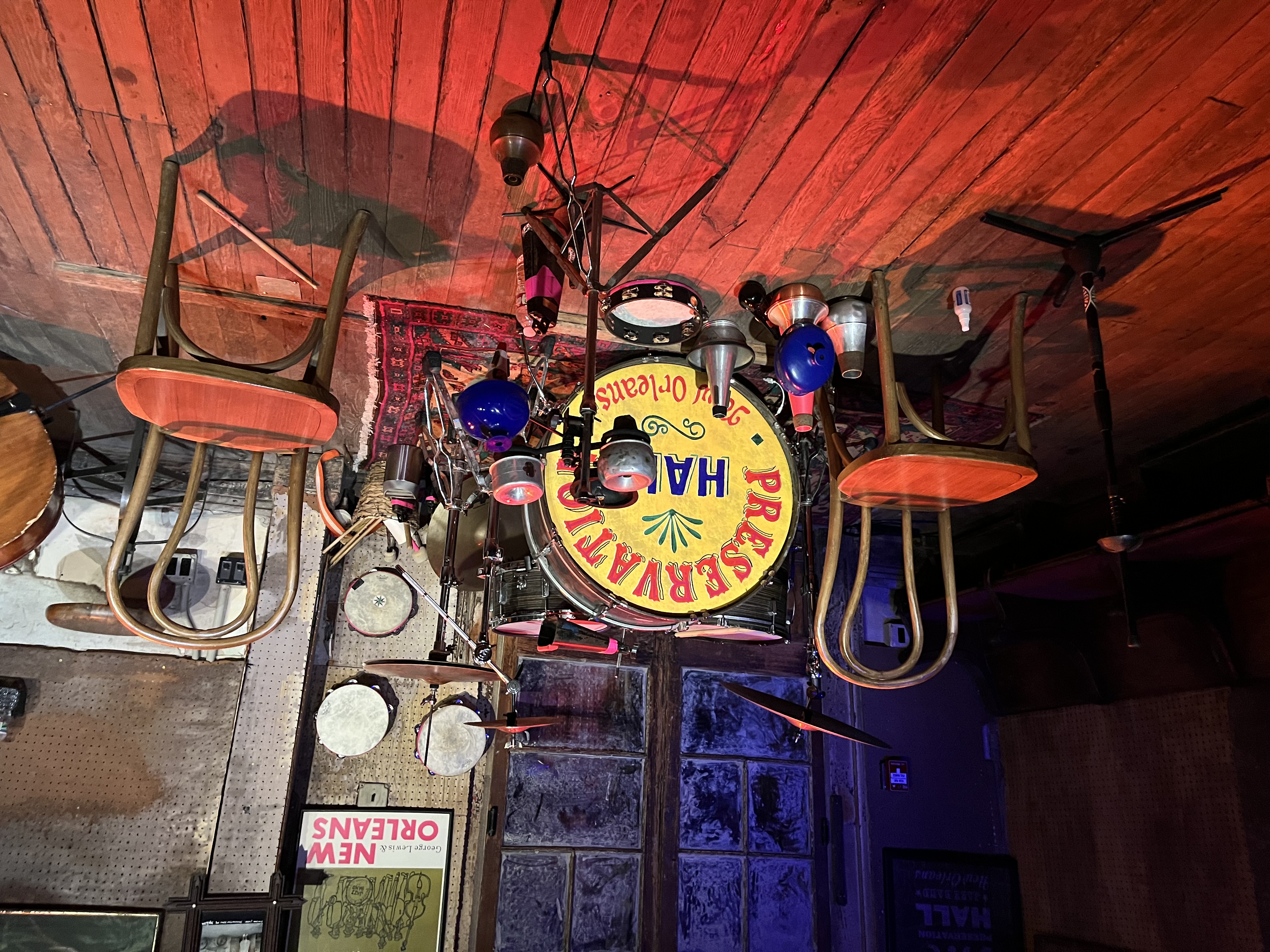 A drum set and chairs sit on stage
