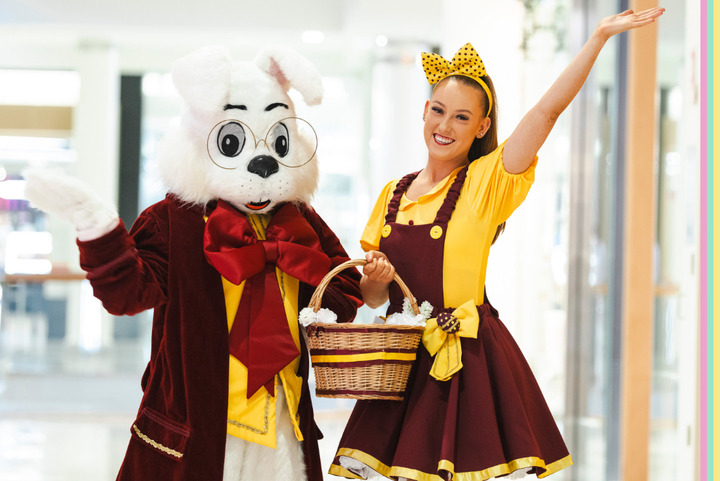 Easter Bunny character and woman image together with basket