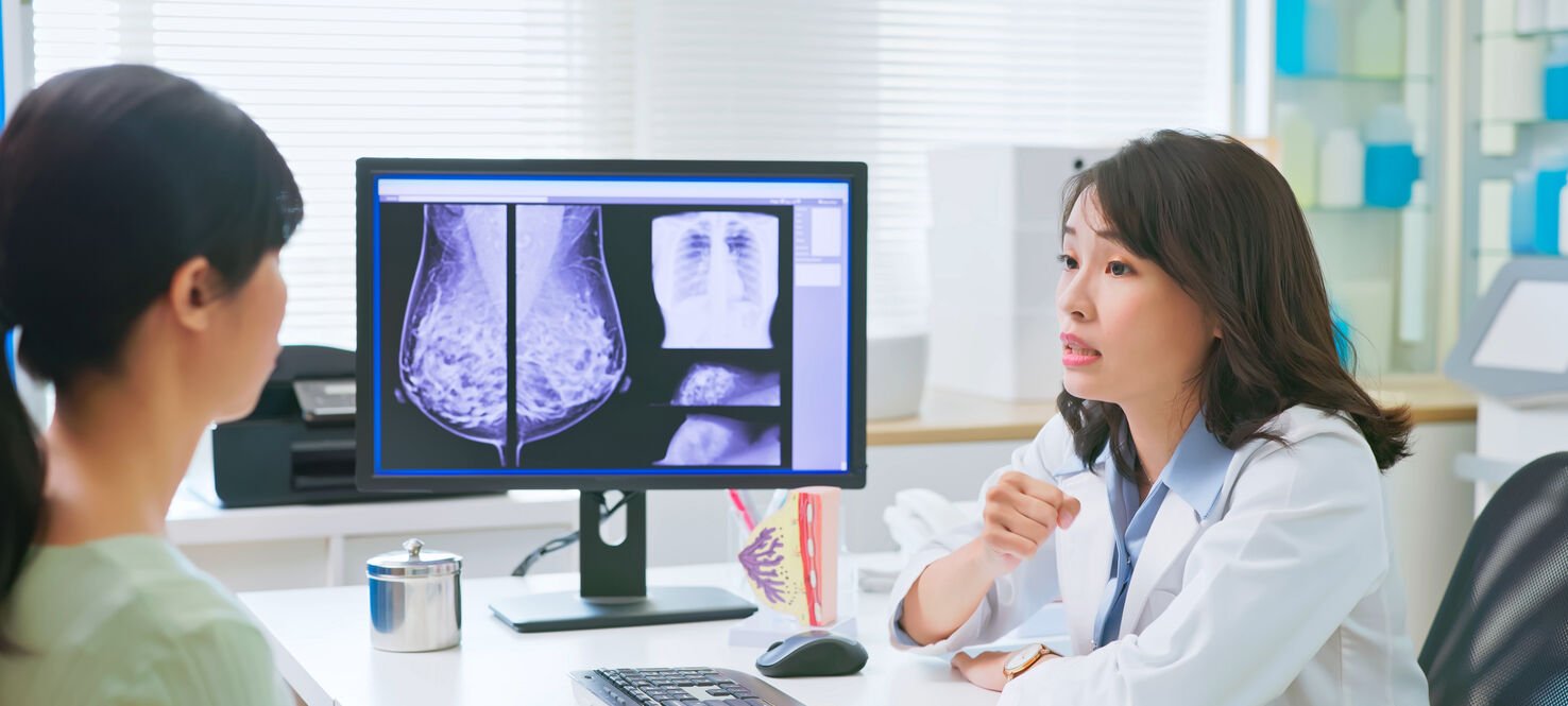 Doctor consults patient on mammogram results 