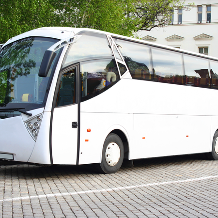 Photo of a coach bus parked in a city, representing travel from Germany.