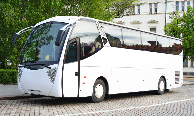 Photo of a coach bus parked in a city, representing travel from Germany.