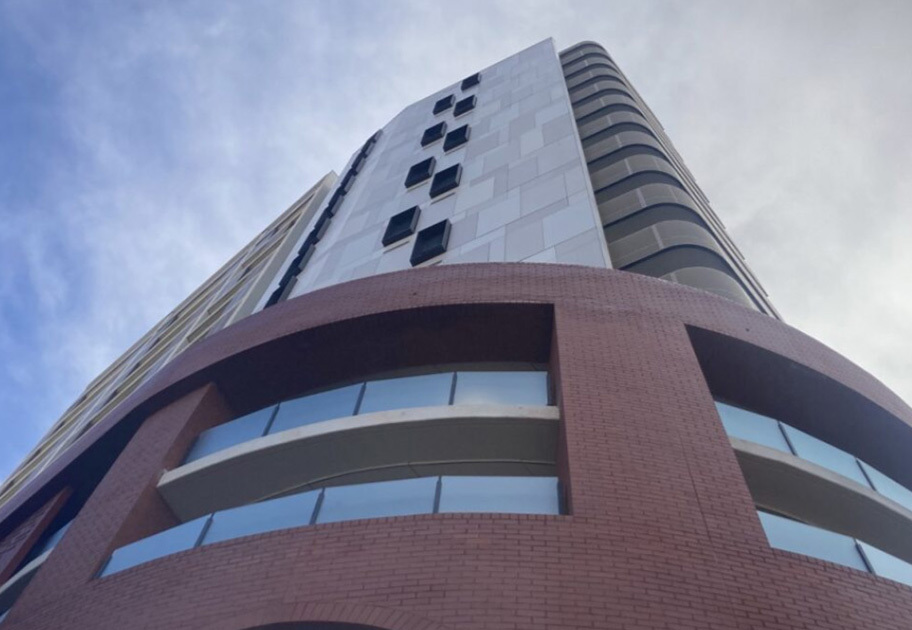 Low-angle view of East Perth Common Ground housing facility under construction, 2025