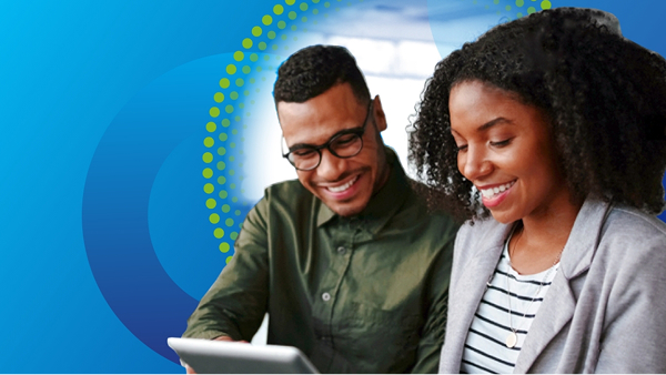 A man wearing glasses and a woman with curly hair smile while looking down at a tablet they are holding. They are partially framed by a large blue circle and a dotted yellow-green circular arc on a blue background.
