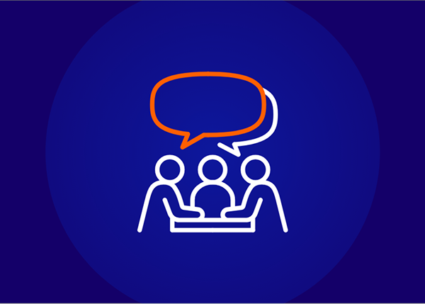 An icon depicting three stylized people seated at a table with an orange and white overlapping speech bubble above them, on a dark blue background.