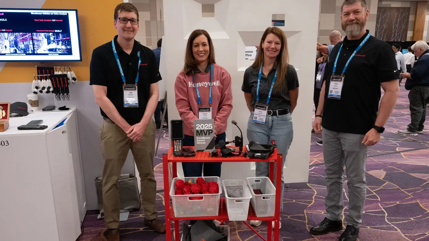 A line of four people on an event floor space