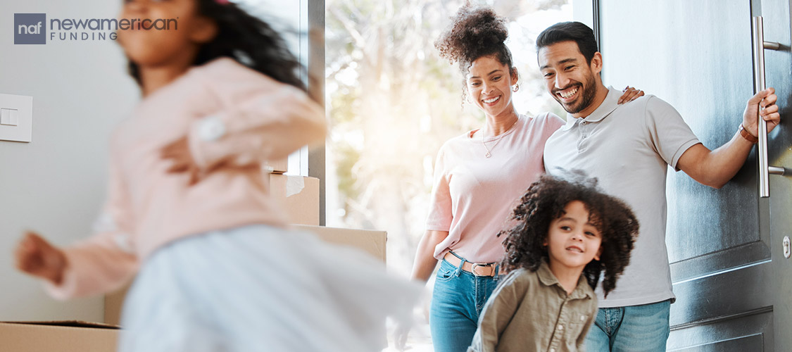 family entering their new home