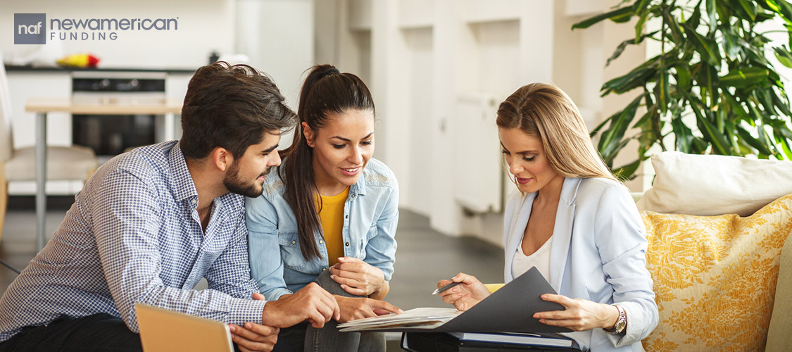 clients with agent going over paperwork