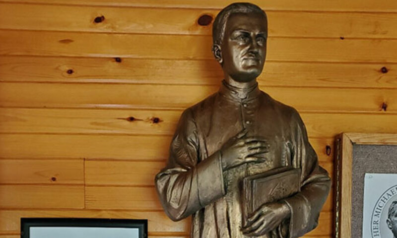 Father McGivney statue at the National Shrine of Cross in the Woods.
