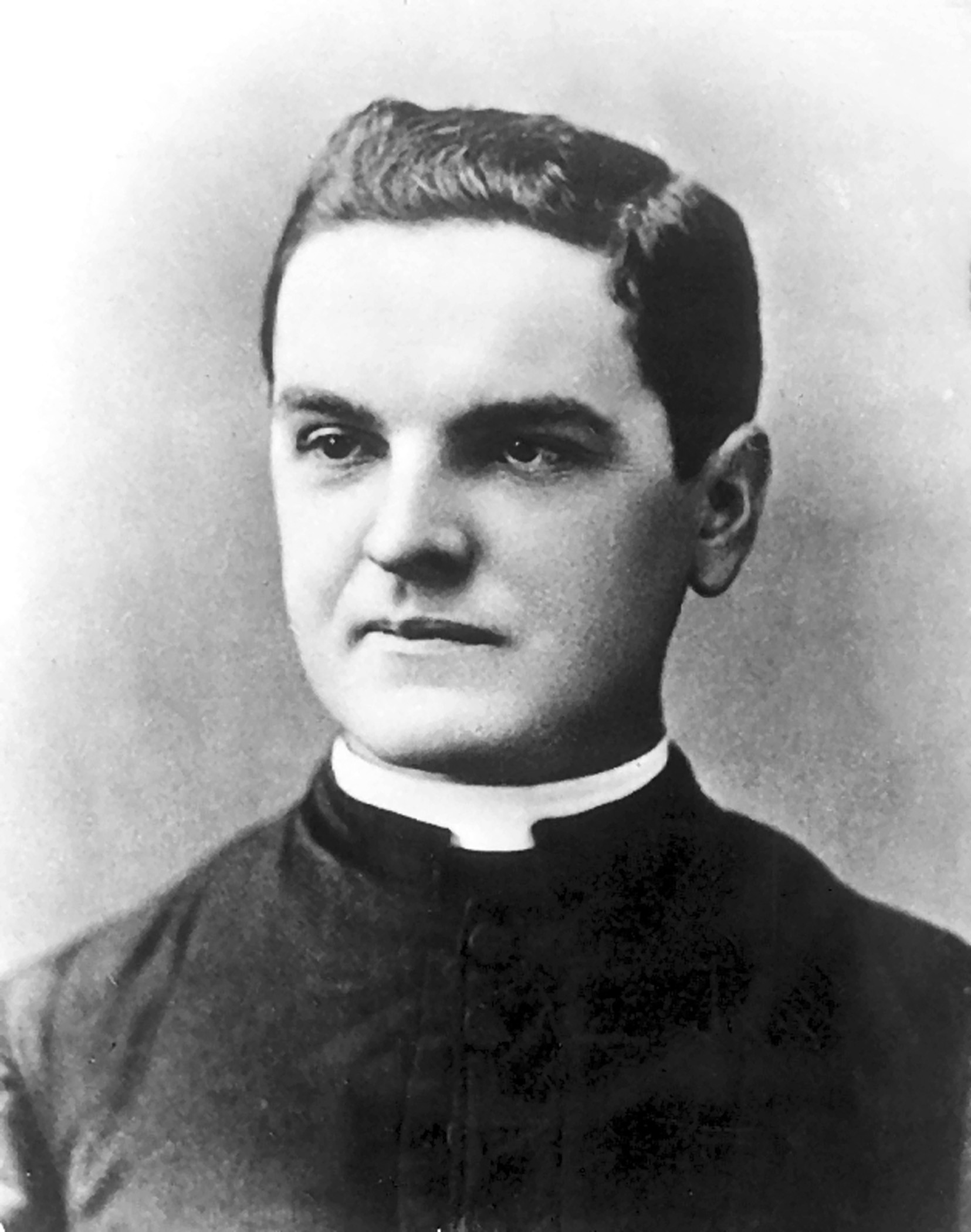 Black and white portrait photo of Father Michael J. McGivney by John J. Tierney.