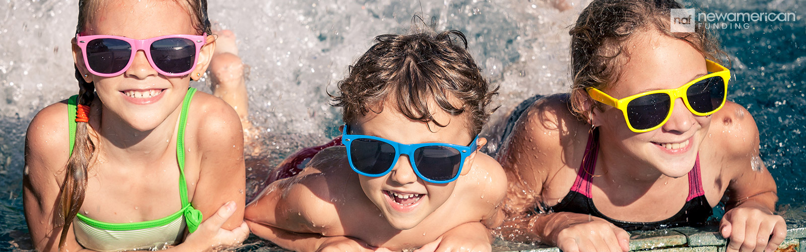 happy kids with colorful sunglasses enjoying the pool