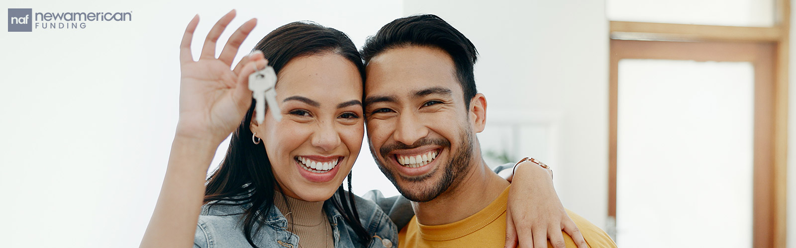 couple showing of new house keys