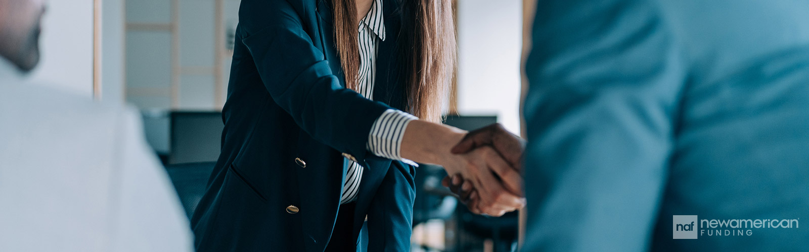 agent shaking hands with client