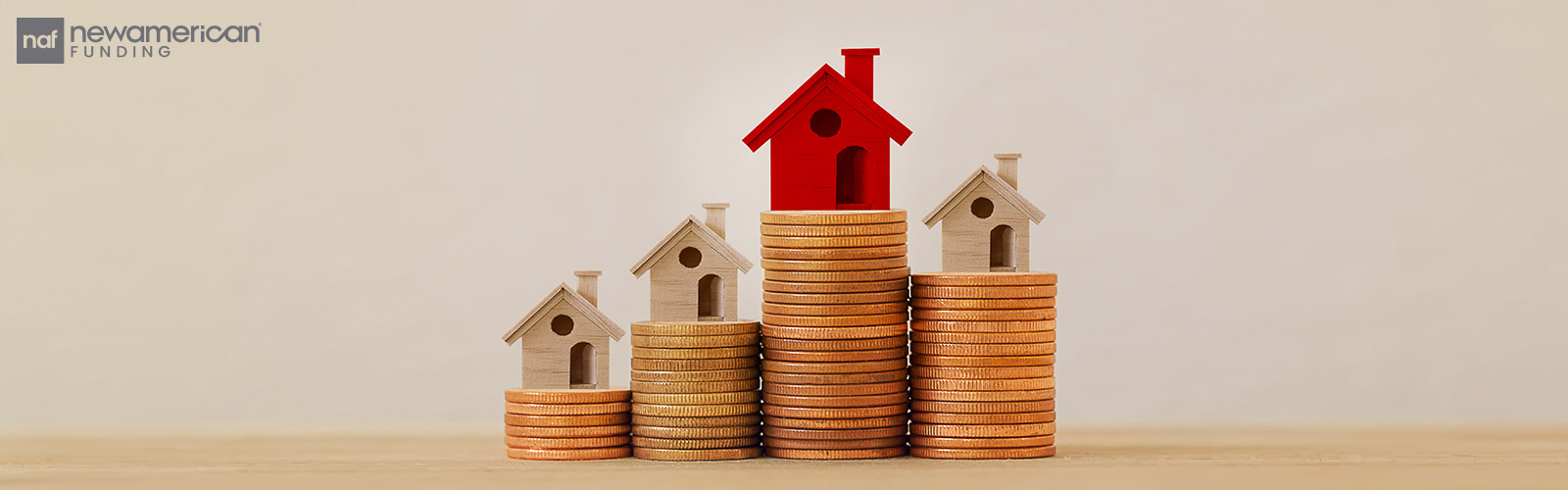 house models on stacks of coins