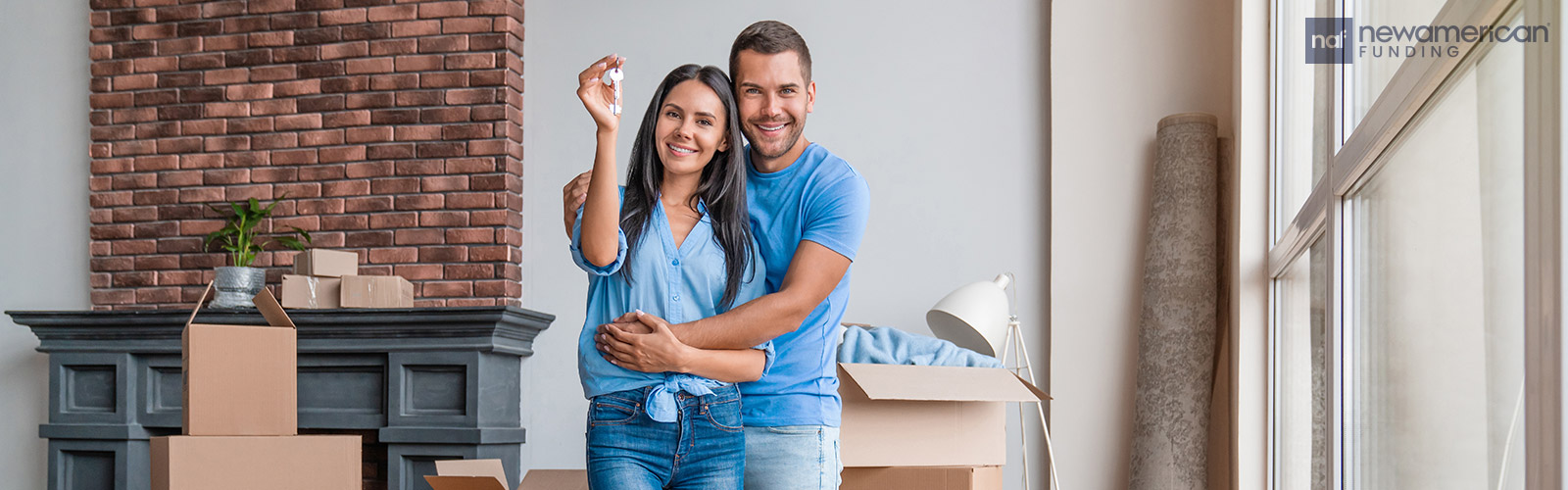 couple showing of their new house keys