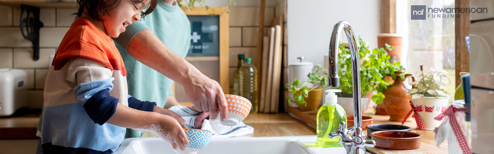 father and son washing dishes