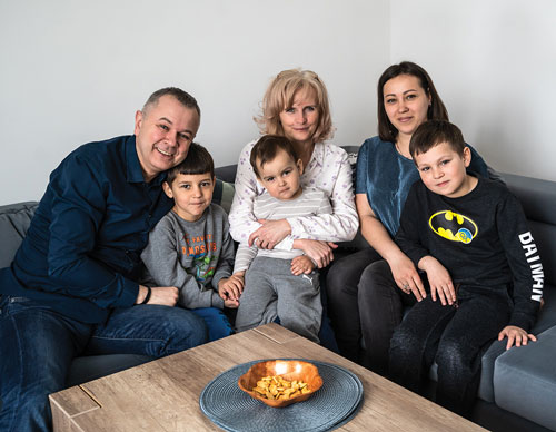 Family sitting on couch